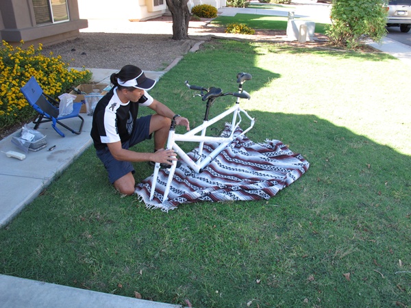 Photo is of Tauru with the tandem's frame and fork in front of him.