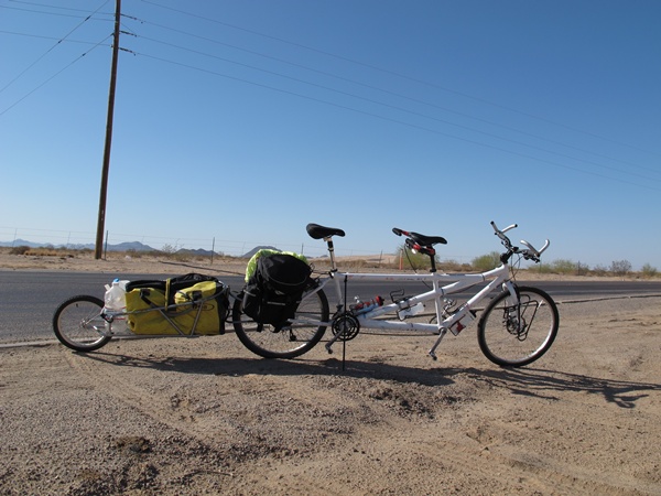 Photo is of the tandem and the trailer standing on the side of the road.