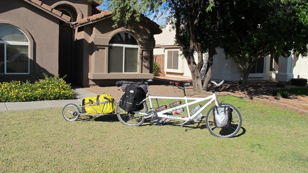 Photo of the bike loaded with all the gear packed in the front and rear panniers and in the stuff sack on the trailer.  The bike with trailer is 11 and a half feet long.